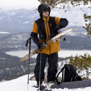 Jones rider Garrett Warnick wears the Men's MTN Surf Recycled Shell Jacket in Sierra Brown