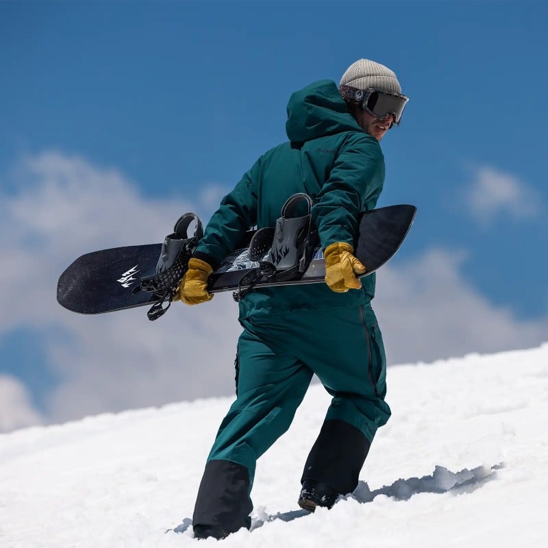 Jones rider Inaki Odriozola wears the Men's Shralpinist Stretch Recycled Bibs in Pacific Teal