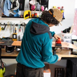 Jones rider Inaki Odriozola wears the Men's Recycled Fleece Hoodie in Pacific Teal