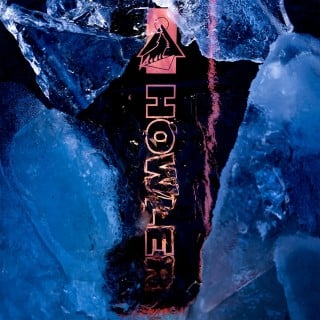 The Howler logo on the board submerged in ice.