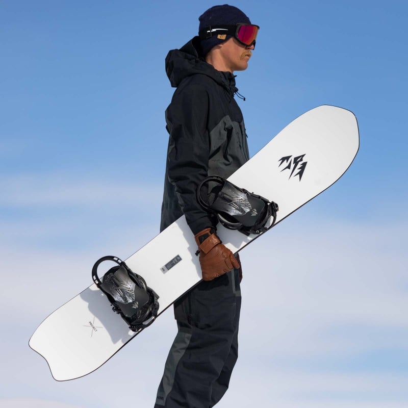 Jones team rider Jimmy Goodman holding the Men's Ultralight Project X Snowboard.