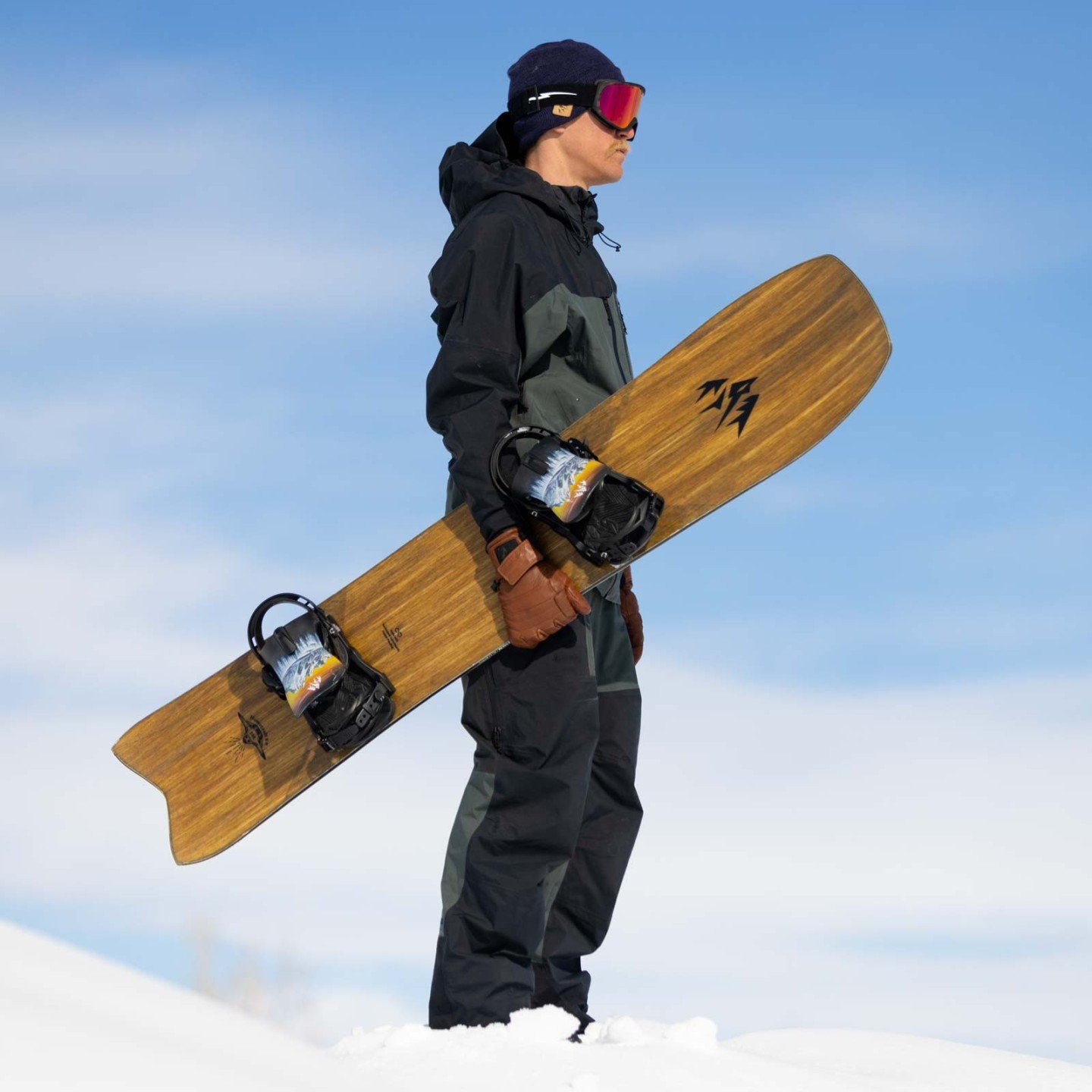 Jones team rider Jimmy Goodman holds the Jones Hovercraft 2.0 Snowboard 2024